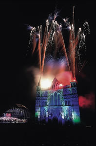 Fireworks exploding above a building.
