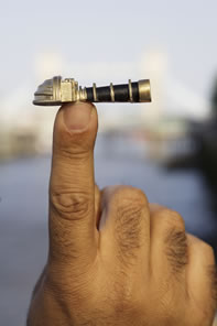The Telectroscope Minumental poised on a fingertip